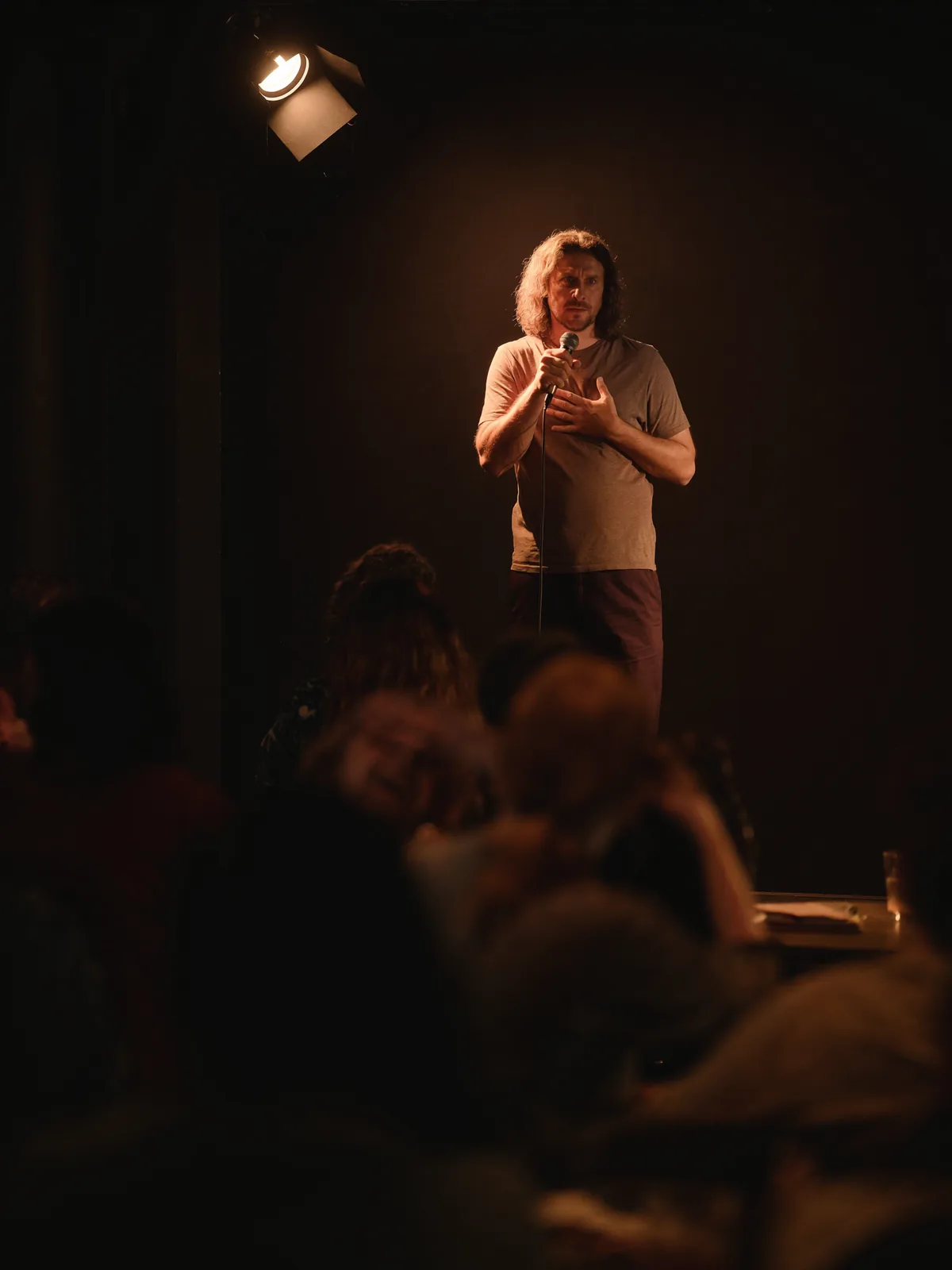 Speaker sharing their failure story on stage